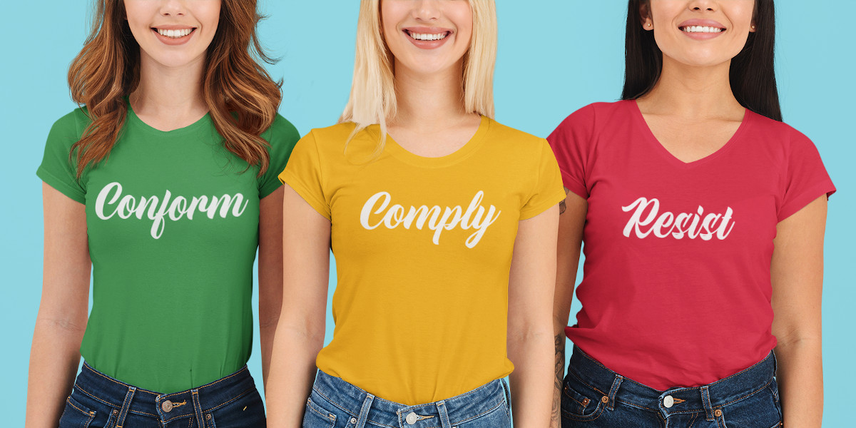 Women wearing shirts saying Conform Comply Resist