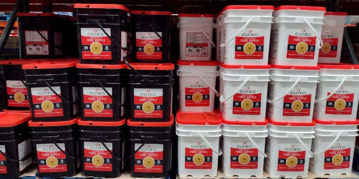 A stack of emergency food buckets in a warehouse store.